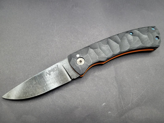 UK Legal friction folding knife Rock textured Black and Orange G10