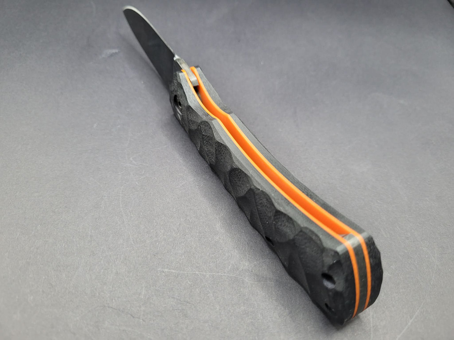 UK Legal friction folding knife Rock textured Black and Orange G10